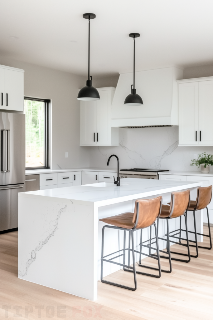 white marble island white kitchen black hardware barstools